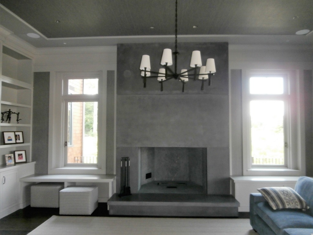 Image of a fireplace designed using decorative concrete finish
