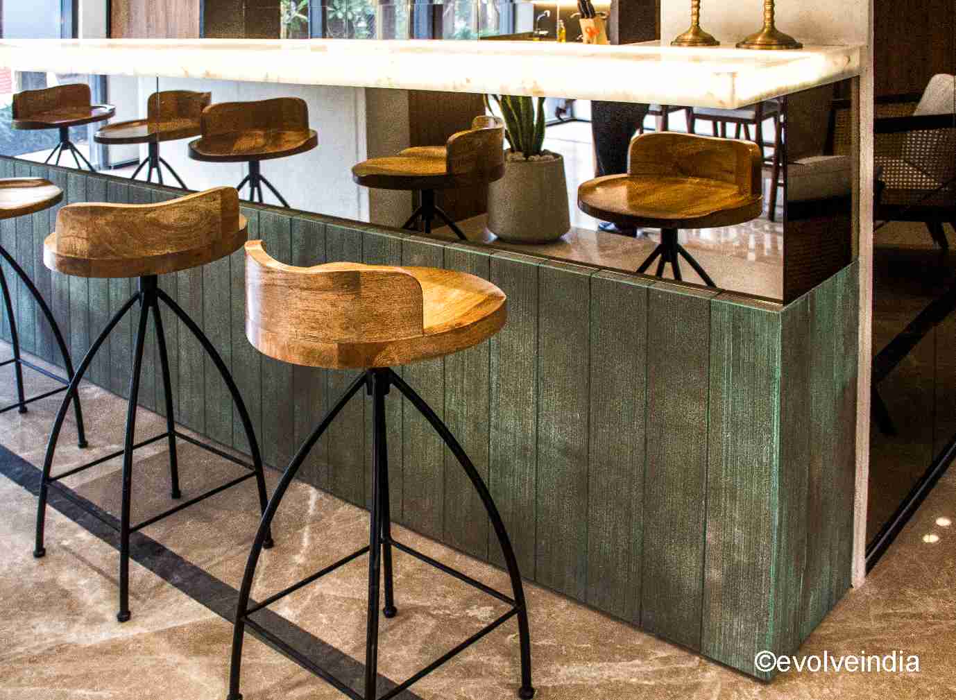 Bar table designed using copper patina panels by Evolve India