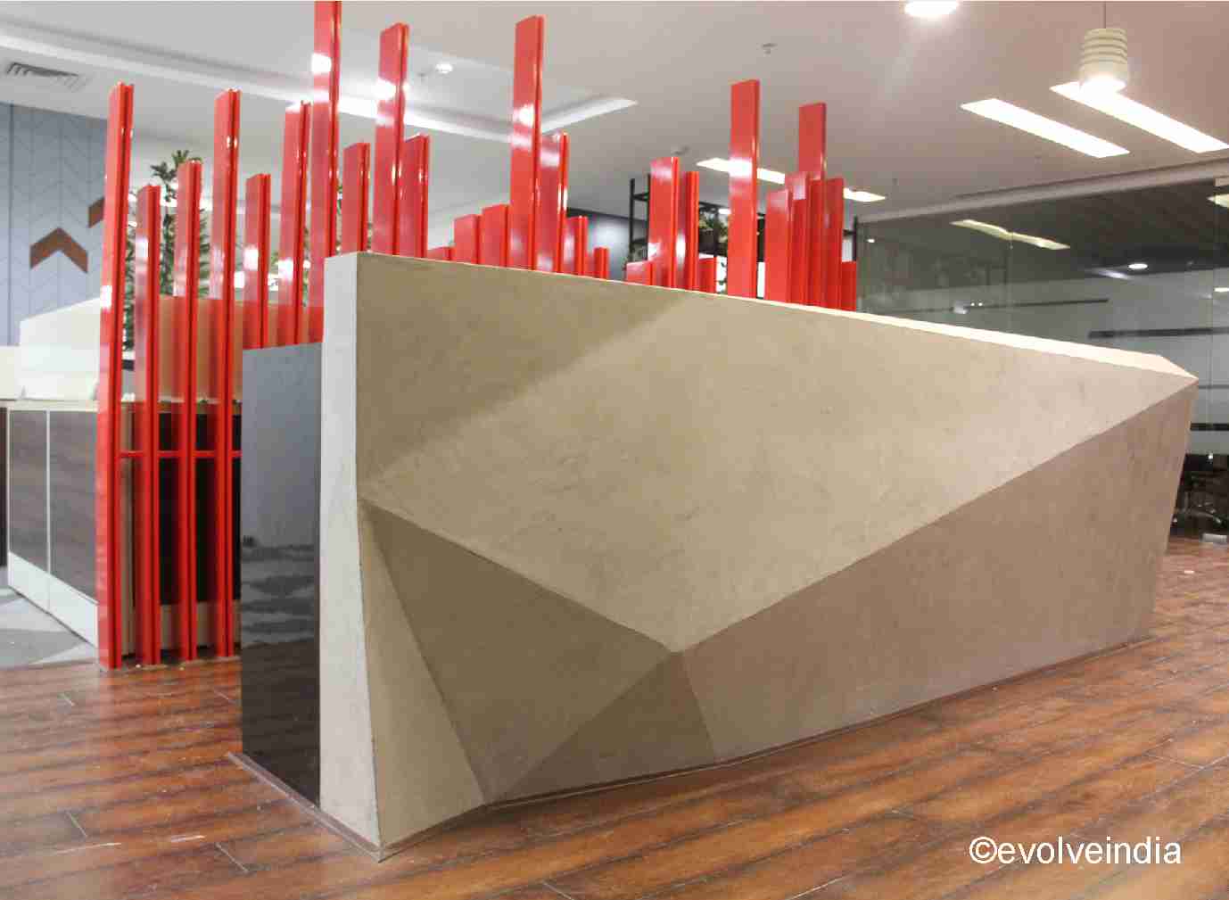 Reception table designed by Evolve India using decorative concrete finish