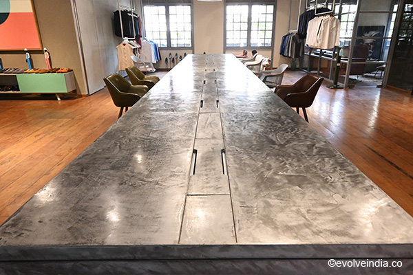 Conference table designed using Evolve India's decorative concrete finish