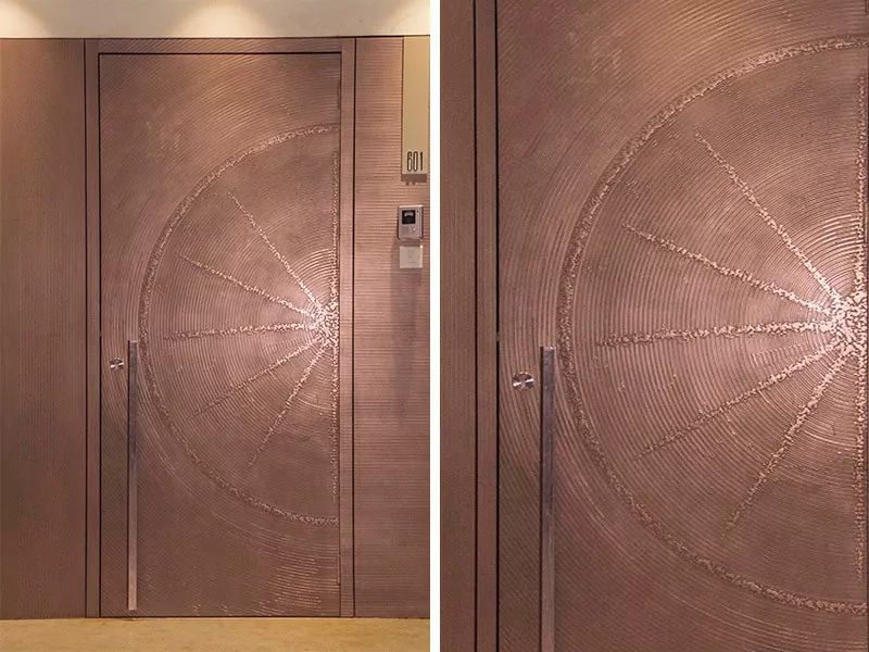 Modern door design by Evolve India, finished using copper liquid metal coating