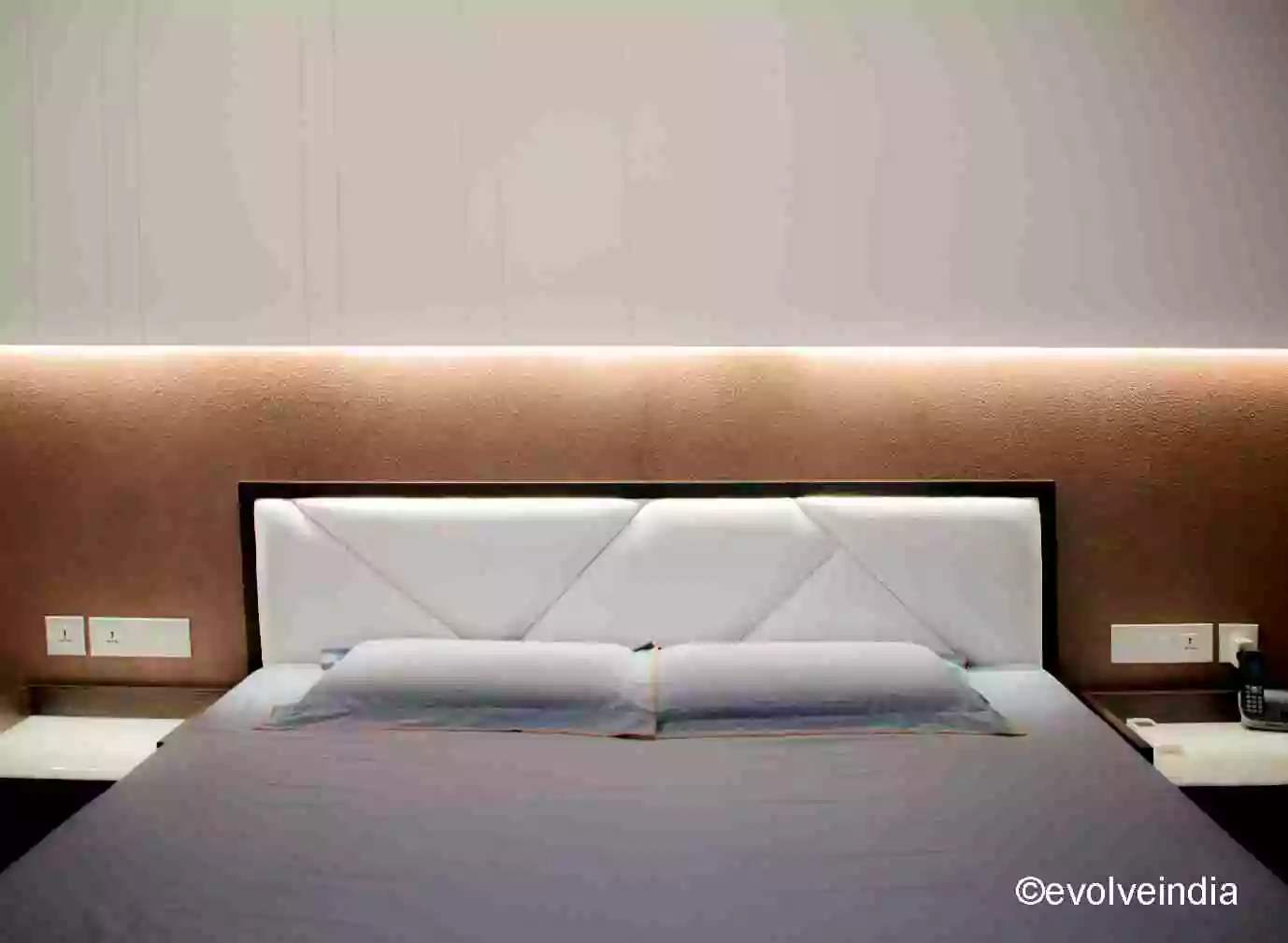 Bed back accent wall designed by Evolve India