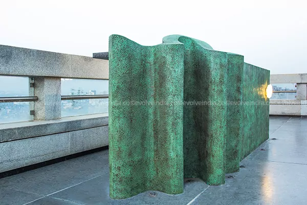 Rooftop bar table designed with Evolve's copper patina finish