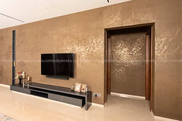 Accent wall designed using Evolve India's liquid metal bronze finish