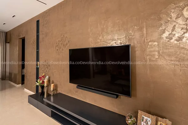 Accent wall designed using Evolve India's liquid metal bronze finish