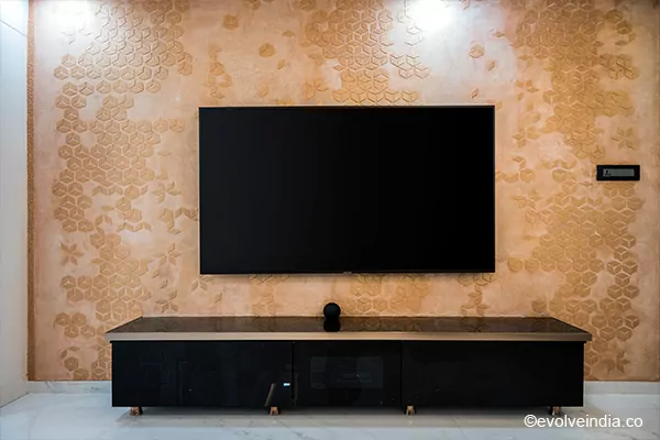TV backwall designed using Evolve India's decorative concrete finishes