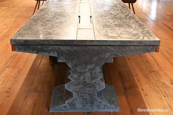 Conference table designed using Evolve India's decorative concrete finish